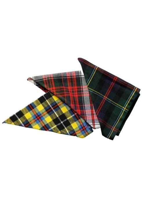 Three folded dog bandanas in yellow, red and green tartans