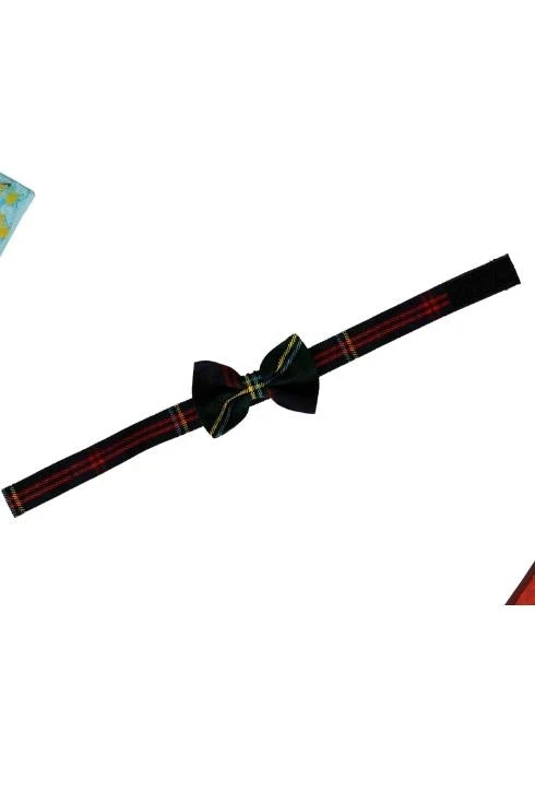 Dark tartan dog bow tie on a slim collar strap, laid flat