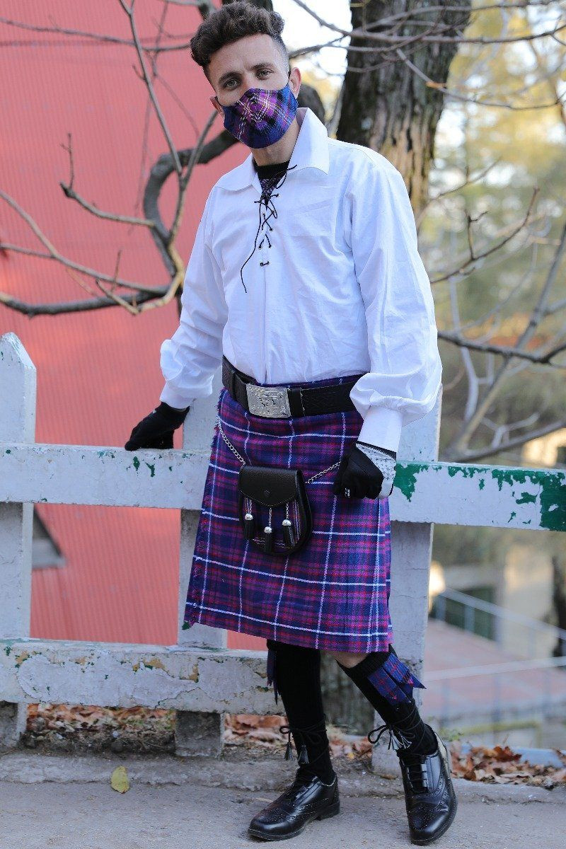 Purple tartan kilt with sporran, man wearing matching tartan face mask