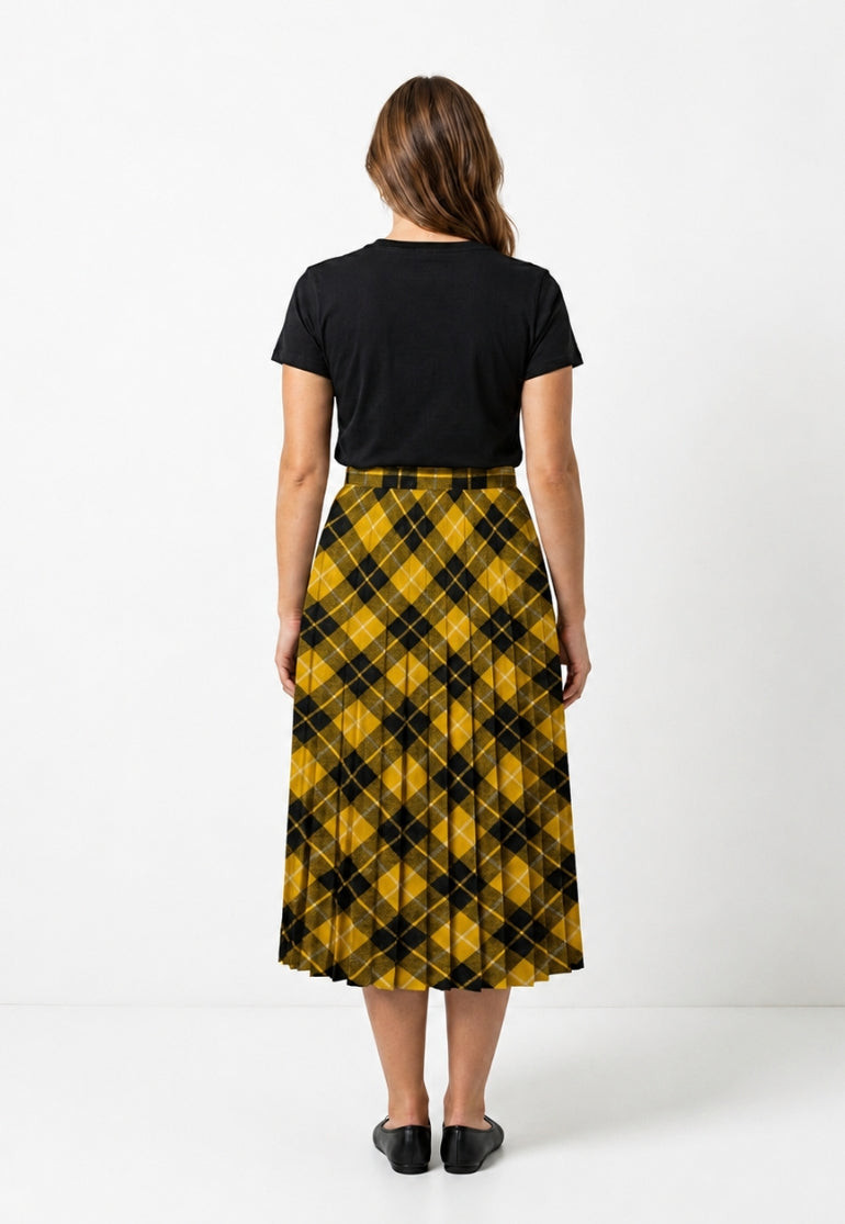 Back view of woman in yellow and black tartan precision pleated midi skirt