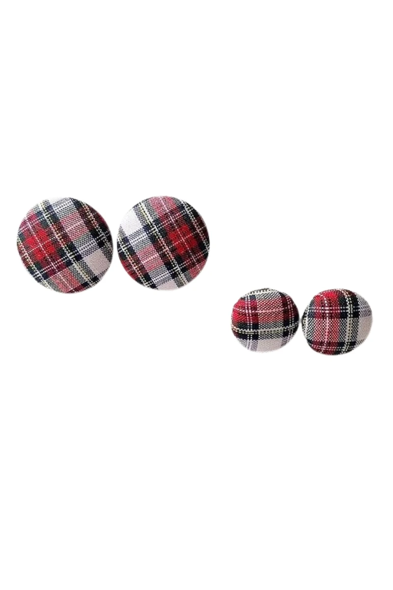 Two pairs of red, white and black tartan stud earrings in different sizes