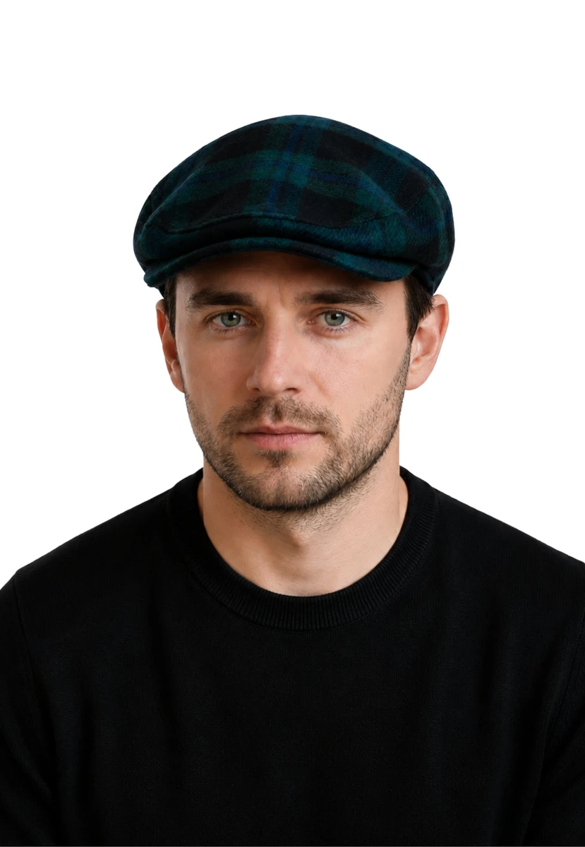 Button down plaid flat cap in dark green and navy tartan worn by a man, front view