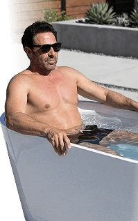 Man enjoying an outdoor cold plunge