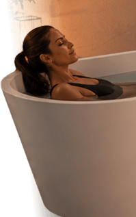 Woman relaxing in a warm plunge bath