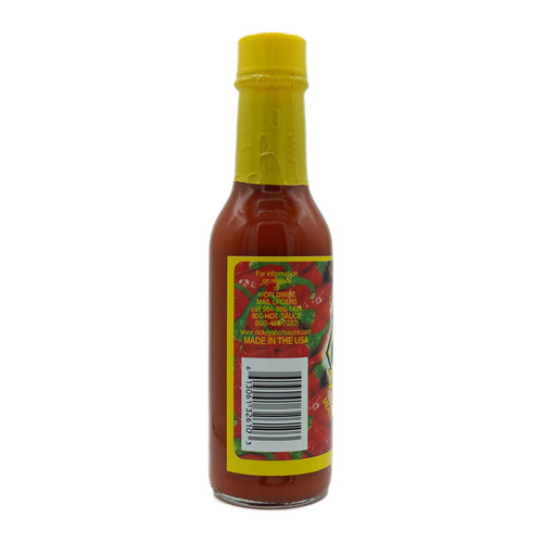 Side view of Ricky’s Louisiana Hot Sauce, showcasing label details for worldwide mail orders, barcode, and ‘Made in the USA’ marking on a bright yellow background. Side view of Ricky’s Louisiana Hot Sauce, showcasing label details for worldwide mail orders, barcode, and ‘Made in the USA’ marking on a bright yellow background.