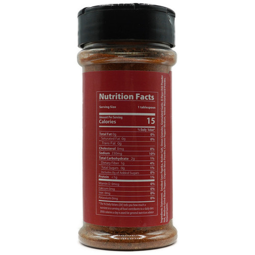 The reverse side of the 4-ounce jar of “Sugar Free Pitbull BBQ Chili Rub,” displaying the nutritional facts label on a red background. The details include calorie information and ingredients, with the same black lid visible at the top. The reverse side of the 4-ounce jar of “Sugar Free Pitbull BBQ Chili Rub,” displaying the nutritional facts label on a red background. The details include calorie information and ingredients, with the same black lid visible at the top.