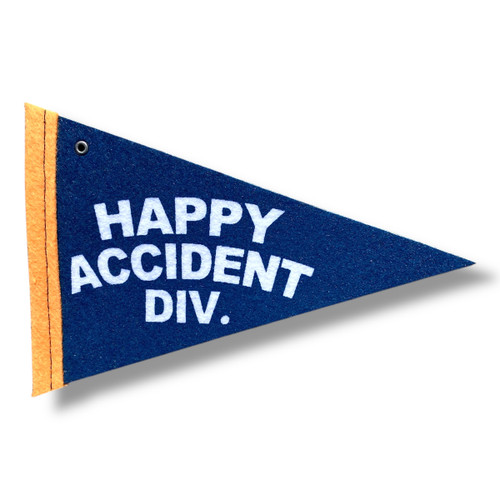 small blue pennant that says happy accident div