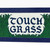 banner that says touch grass
