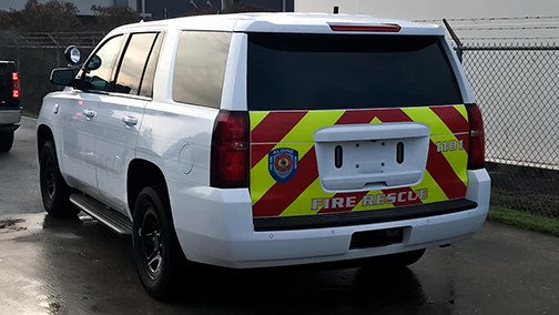 High-visibility reflective chevrons on a Fire Department Tahoe