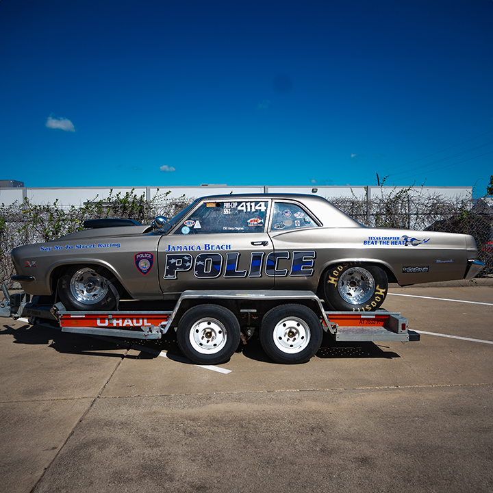 Custom reflective police car graphics featuring bold designs and reflective materials for enhanced visibility and professional branding. Distressed American Flag