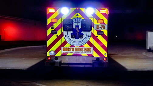 Enhanced visibility and safety for EMS vehicles with reflective chevrons and window perforated film.