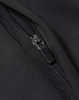 A close-up of a black softshell jacket featuring a zipper detail and a textured fabric finish.