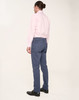 Men's flexi chino pants in navy, paired with a light pink shirt. The back view showcases the fit and design.