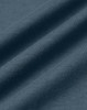 A close-up of a textured fabric in a soft, dark blue shade, showcasing the quality of cotton material.