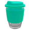 A reusable coffee cup with a clear glass body and a turquoise silicone lid and sleeve, featuring a logo.