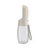 A drink bottle designed for pets, featuring a clear body with a beige top and a strap.
