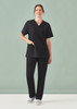 A pair of unisex straight leg scrub pants in black, paired with a matching black scrub top.