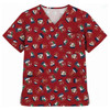 A unisex Christmas scrub top in red featuring a festive pattern of bells, Santa hats, and other holiday motifs.