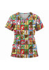 A women's Christmas scrub top featuring a festive pattern with animals in Santa hats and Christmas colours.