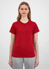 A women's short sleeve tee in red, showcased on a model with light brown hair, paired with grey bottoms.