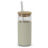 A glass tumbler with a light green silicone sleeve, bamboo lid, and stainless steel straw. It features a logo.