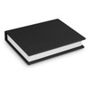 A black hard cover notebook with a plain white spine visible. The notebook lies flat, showcasing its sleek design.