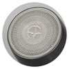 A silver and black portable speaker with a textured surface and a central logo.
