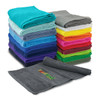 A stack of vibrant gym towels in various colours, including grey, blue, pink, and green, with a towel displaying a logo.