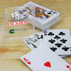 A clear plastic case holds a deck of playing cards featuring red and black designs with a logo.