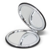 A compact mirror with a sleek black exterior and a shiny silver frame, opened to reveal two reflective surfaces.