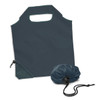 A foldable reusable grocery bag in dark green, stored compactly in a matching pouch. Features a handle and drawstring closure.