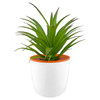 A small white plant pot with an orange rim holds a vibrant green artificial plant.