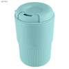 A drink bottle in light blue, featuring a ribbed design and a lid with an opening, includes a logo.