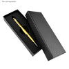 A black packaging box with a textured design, containing a gold writing pen on a black foam insert.
