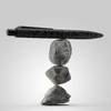 A black pen with a textured design balanced on three stacked rocks, showcasing the "Marko Stone Pen" product.