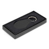 A round leather key ring in a black gift box with a soft interior. The key ring features a silver metal ring.