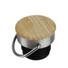 A drink bottle lid with a bamboo top and a silver metal ring, featuring a black rubber base.