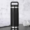A drink bottle in matte black with a stainless steel base and a handle, featuring a simple design.