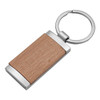 A wooden panel key ring with a silver metal frame and a round keyring attachment.