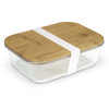 A glass lunch box with a bamboo lid, secured with a white band.