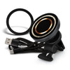A black wireless car charger with a circular design, accompanied by a USB cable and a mounting clip.