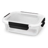 A rectangular glass lunch box with a white lid and black clips, featuring a transparent body.