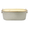 A bamboo lunch box in light grey with a bamboo lid and decorative handles. Includes a logo on the side.
