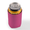 A drink bottle is wrapped in a bright pink stubby cooler, designed to maintain the temperature of the can.