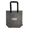 A gray tote bag with black handles featuring a printed logo label that reads "NOMADSCAPE."