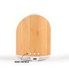 A wireless speaker with a bamboo finish featuring music control buttons and a charging port at the bottom.