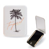 A compact mirror with a palm tree design, featuring a white exterior and a reflective black interior.