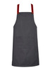 A dark grey apron with red straps and a front pocket, featuring a logo on one side.