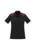 A women's black polo shirt with short sleeves, featuring red accents on the collar and shoulders, and includes a logo.
