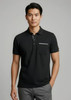 A black short sleeve polo shirt featuring a pocket and a logo. Plain design with a modern fit.